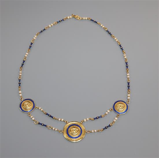 A 750 yellow metal, seed pearl and blue enamel set triple disc necklace, gross 23.4 grams.